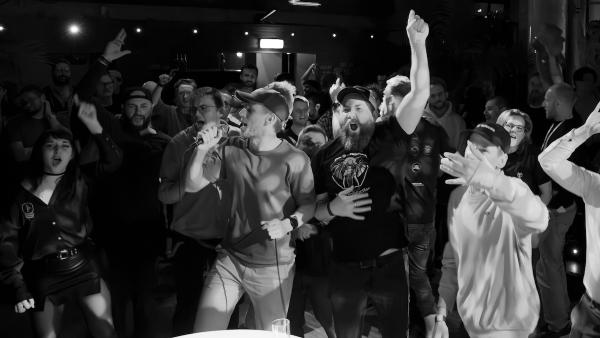 Crowd singing enthusiastically